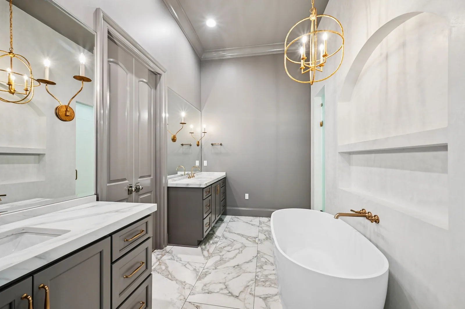 Primary bath, tub + sconces